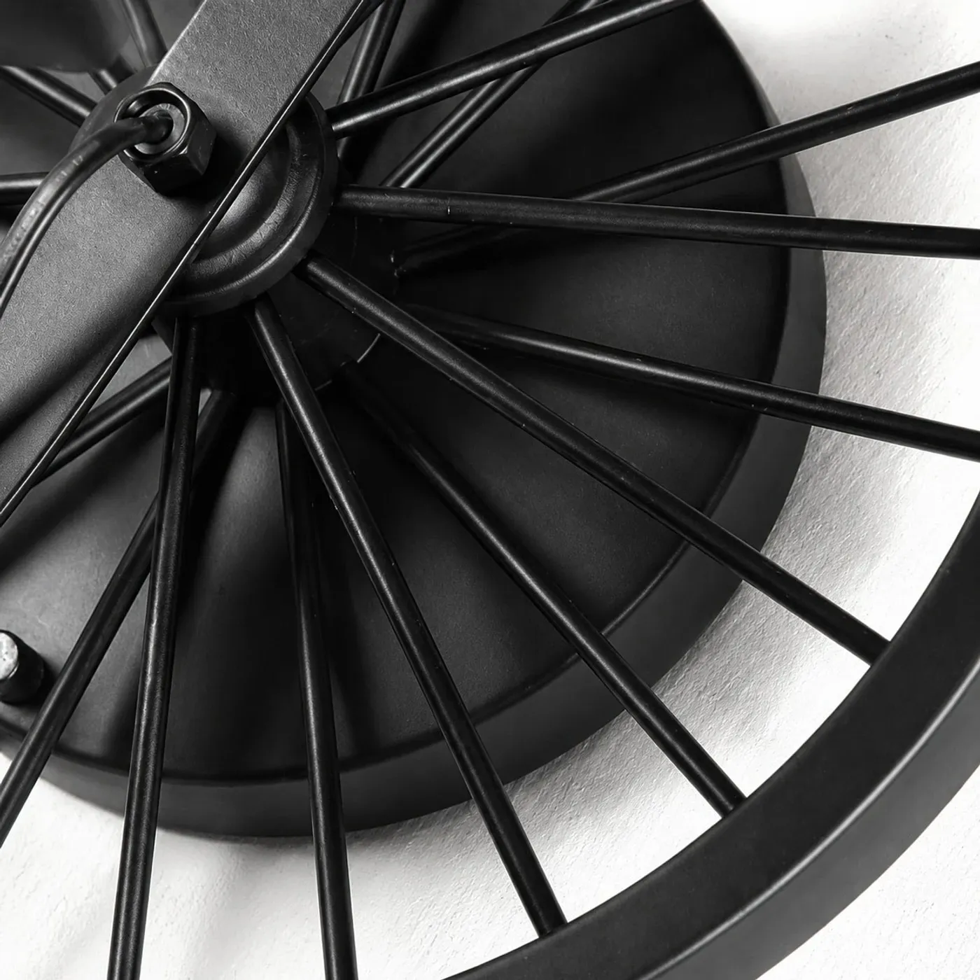 Close view of the black wagon wheel backplate and spoke detail