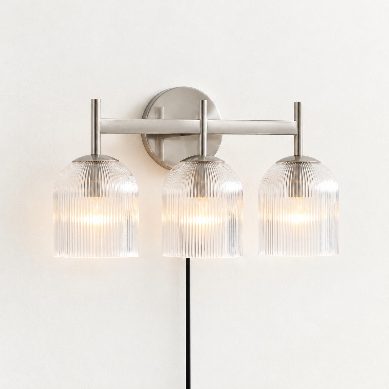 Chrome ribbed-glass wall sconce, three lights