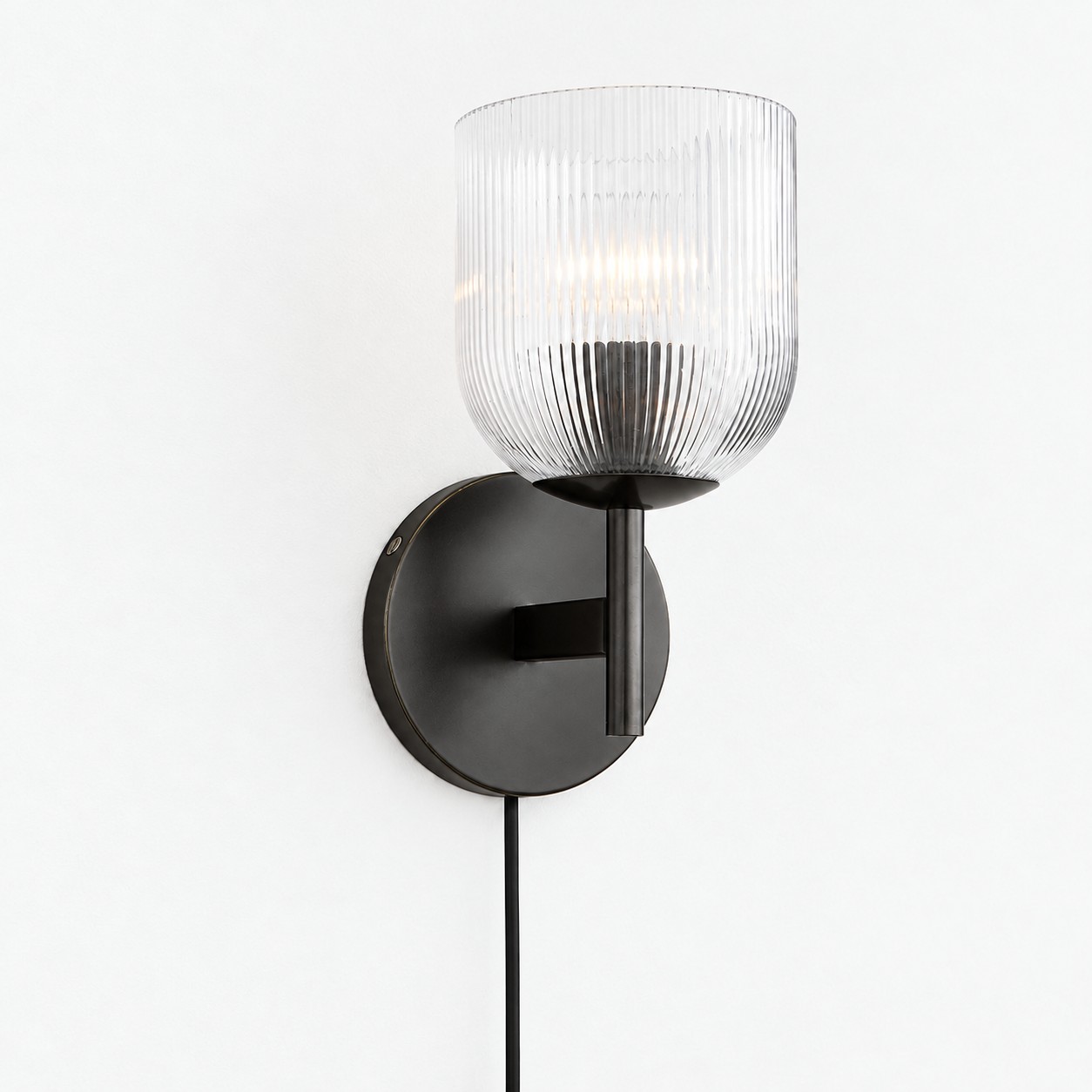 Black ribbed-glass wall sconce, one light